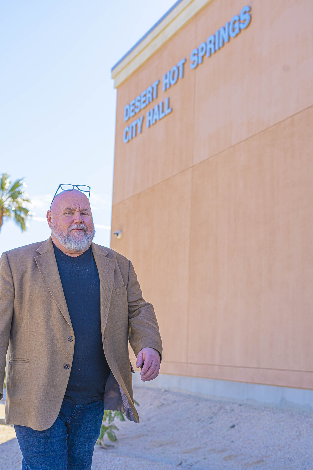 Gary Gardner walking by city hall.